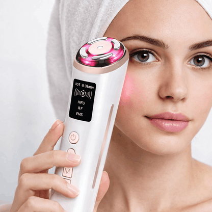 Woman using Velino LUMERA Lift Pro on cheekbone  at-home clinic-grade skin lifting treatment